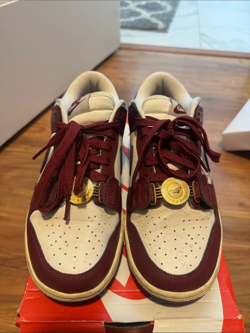 Nike Low-Top Sneakers in Maroon and White with Gold Accents